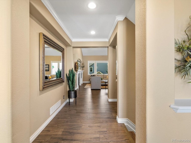 6266 W Prentice Ave, Littleton, CO 80123 - hallway with recessed lighting, baseboards, dark wood-style flooring, ornamental molding, and visible vents