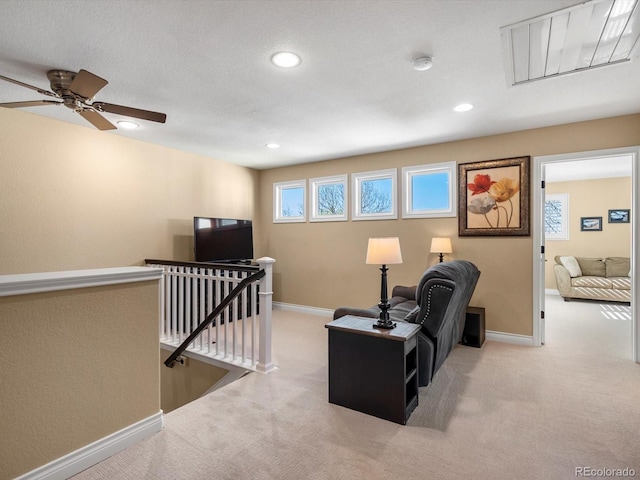 6266 W Prentice Ave, Littleton, CO 80123 - living area with baseboards, carpet flooring, an upstairs landing, and recessed lighting