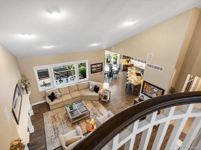 6266 W Prentice Ave, Littleton, CO 80123 - living area with visible vents, wood finished floors, and lofted ceiling