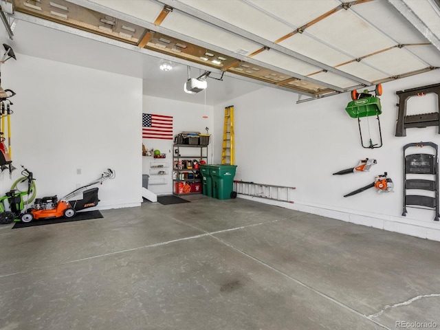 6266 W Prentice Ave, Littleton, CO 80123 - garage featuring a garage door opener