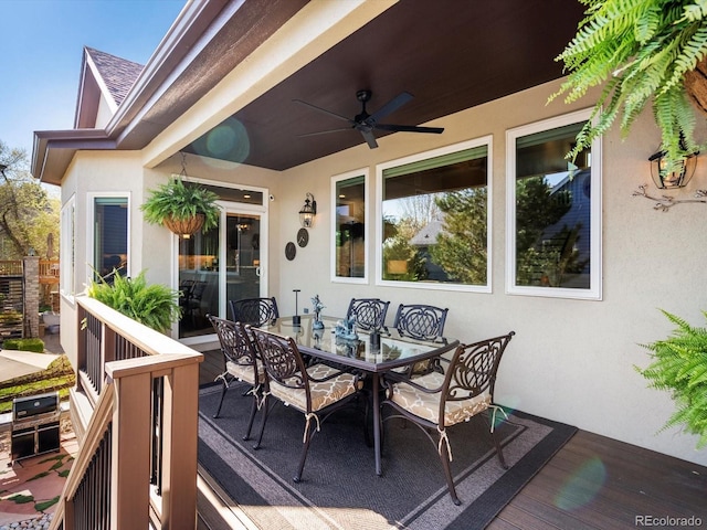 6266 W Prentice Ave, Littleton, CO 80123 - deck with outdoor dining area and ceiling fan