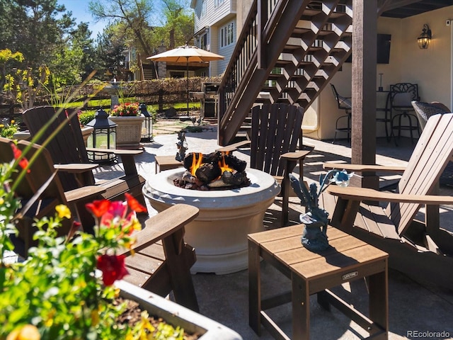 6266 W Prentice Ave, Littleton, CO 80123 - view of patio / terrace featuring a fire pit