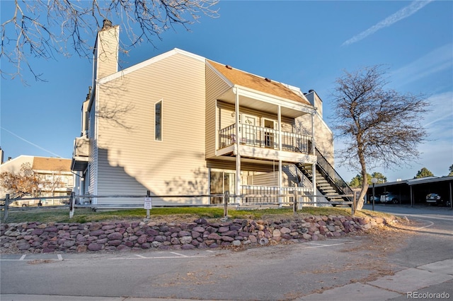 view of front of home with a balcony