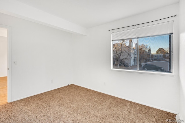 unfurnished room with carpet floors