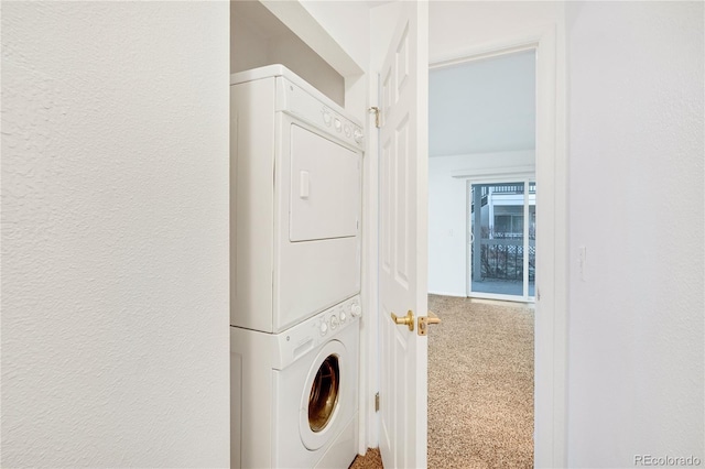 washroom with stacked washer and dryer