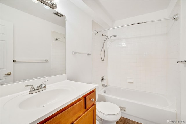 full bathroom with bathtub / shower combination, vanity, and toilet