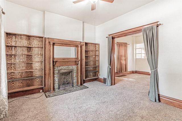 873 S Logan St, Denver, CO 80209 - unfurnished living room with carpet flooring, ceiling fan, and a fireplace with flush hearth
