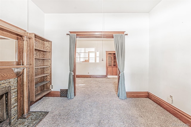 873 S Logan St, Denver, CO 80209 - unfurnished living room with carpet floors and baseboards