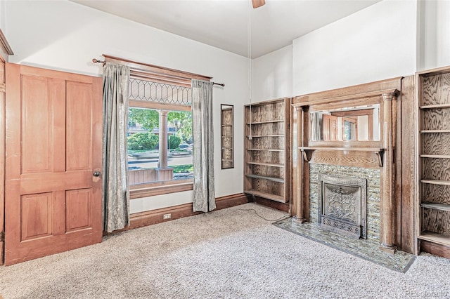 873 S Logan St, Denver, CO 80209 - unfurnished living room with carpet flooring and a fireplace with flush hearth