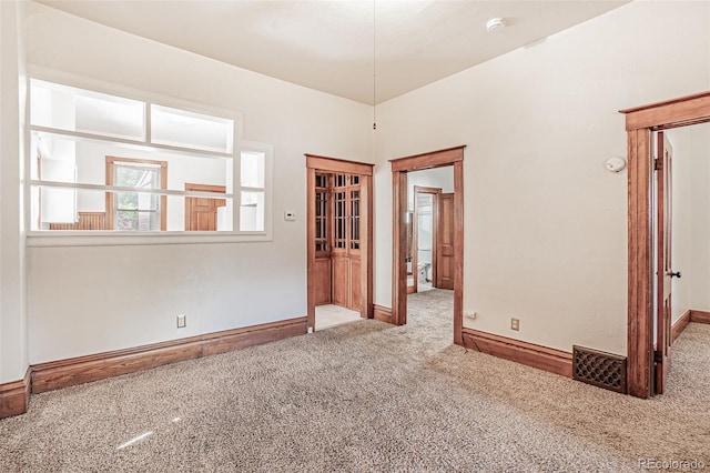 873 S Logan St, Denver, CO 80209 - spare room featuring carpet and a smoke detector