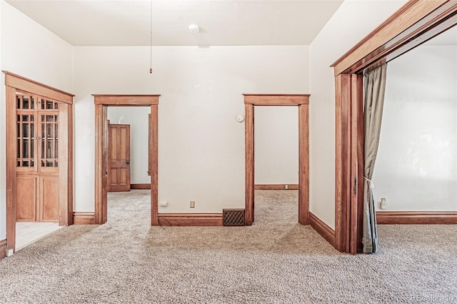 873 S Logan St, Denver, CO 80209 - carpeted spare room with baseboards and a smoke detector
