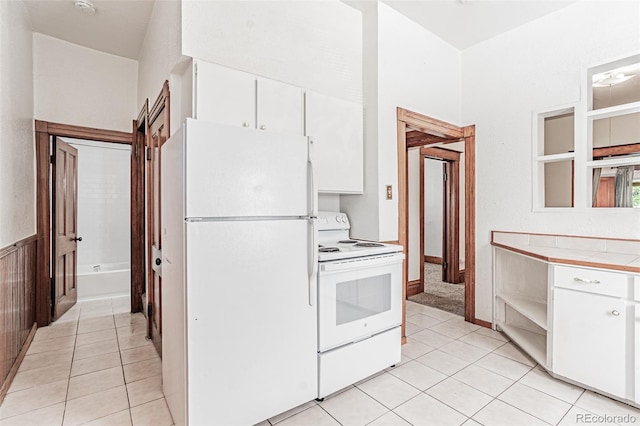 873 S Logan St, Denver, CO 80209 - kitchen featuring white appliances, tile counters, white cabinets, and light tile patterned floors