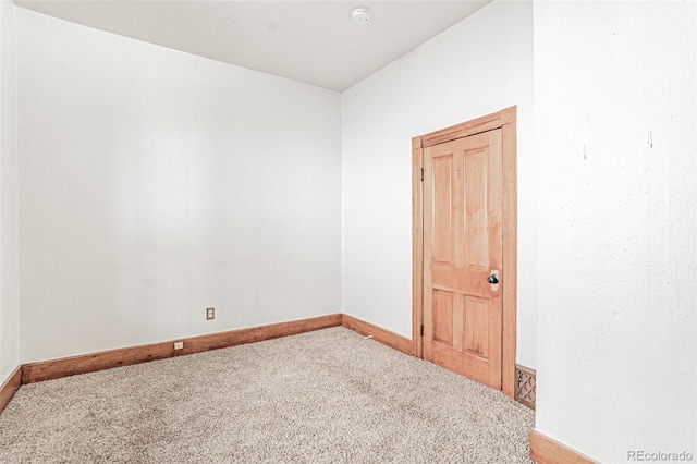 873 S Logan St, Denver, CO 80209 - carpeted empty room with a smoke detector and baseboards
