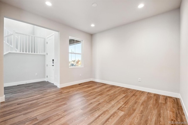 empty room featuring wood-type flooring