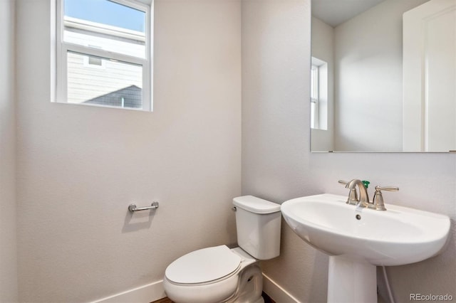 bathroom with toilet and sink