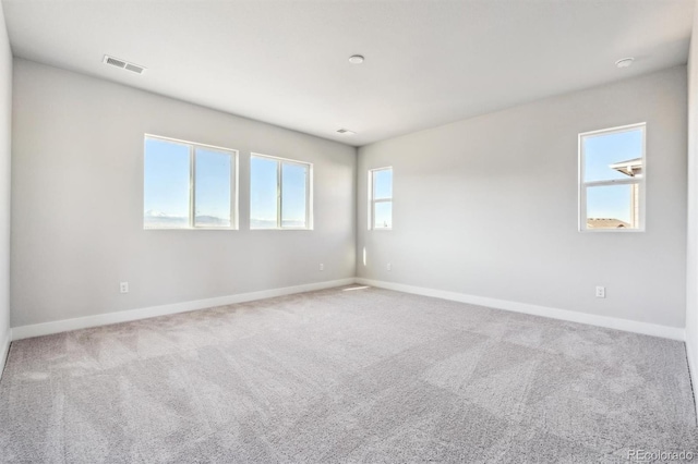 empty room with carpet flooring