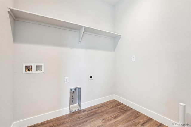 laundry room featuring hardwood / wood-style flooring, electric dryer hookup, and washer hookup