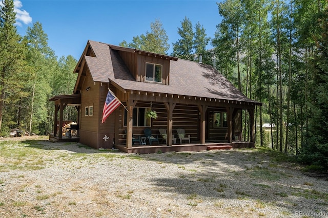25879 County Road 162e, Nathrop, CO 81236 - view of front facade featuring a shingled roof, board and batten siding, and a wooden deck