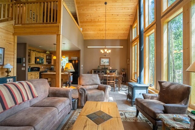 25879 County Road 162e, Nathrop, CO 81236 - living area with a chandelier, high vaulted ceiling, and wooden ceiling