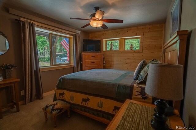 25879 County Road 162e, Nathrop, CO 81236 - bedroom with wood walls, carpet, and a ceiling fan