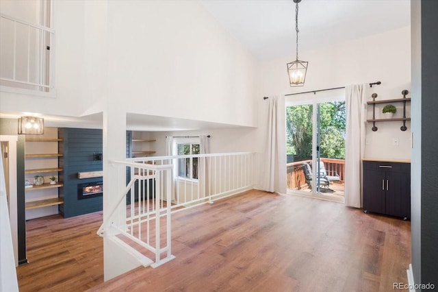 6318 Newton Ct, Arvada, CO 80003 - entrance foyer with a towering ceiling, wood finished floors, and a large fireplace