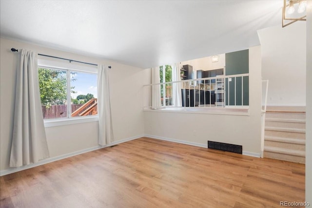 6318 Newton Ct, Arvada, CO 80003 - empty room with wood finished floors and stairway