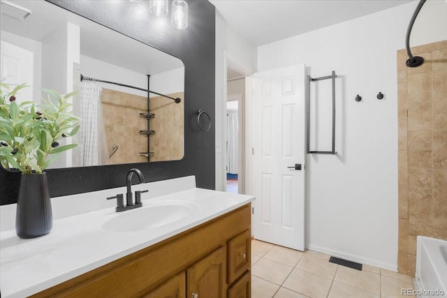 6318 Newton Ct, Arvada, CO 80003 - full bath featuring vanity, tile patterned flooring, and shower / bath combo