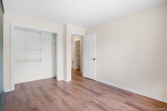 6318 Newton Ct, Arvada, CO 80003 - unfurnished bedroom featuring a closet and wood finished floors