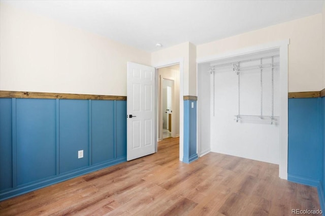 6318 Newton Ct, Arvada, CO 80003 - unfurnished bedroom featuring wood finished floors and a closet