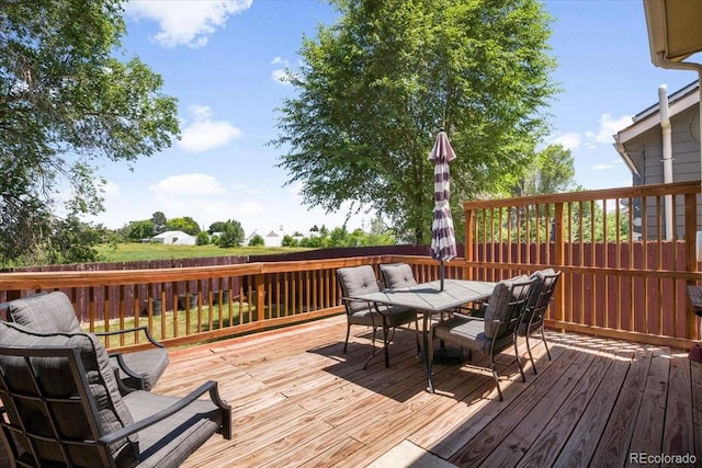 6318 Newton Ct, Arvada, CO 80003 - wooden deck featuring outdoor dining space