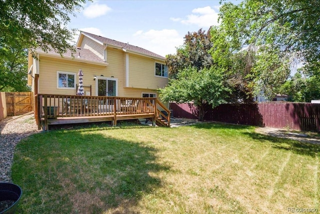 6318 Newton Ct, Arvada, CO 80003 - rear view of property with a fenced backyard and a wooden deck