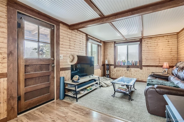 34502 Chilton Ave, Pine, CO 80470 - living area featuring wooden walls, beam ceiling, and wood finished floors