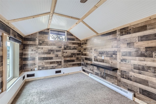34502 Chilton Ave, Pine, CO 80470 - interior space featuring carpet floors, a baseboard radiator, wood walls, and lofted ceiling with beams