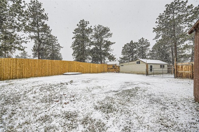 34502 Chilton Ave, Pine, CO 80470 - yard covered in snow with a fenced backyard