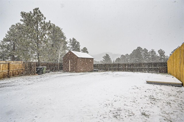 34502 Chilton Ave, Pine, CO 80470 - view of yard with a fenced backyard, an outdoor structure, and a storage unit
