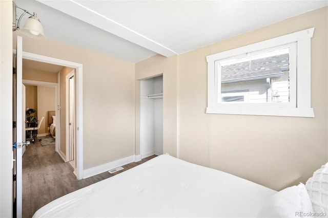 bedroom featuring a closet and hardwood / wood-style floors