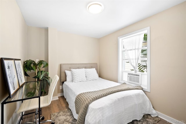 bedroom featuring cooling unit and dark wood-type flooring