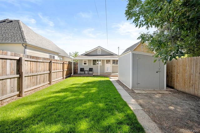 view of yard with a storage unit and a patio area