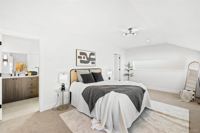 carpeted bedroom with lofted ceiling