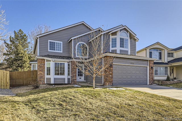 front of property with a garage and a front yard