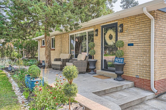 property entrance with a patio