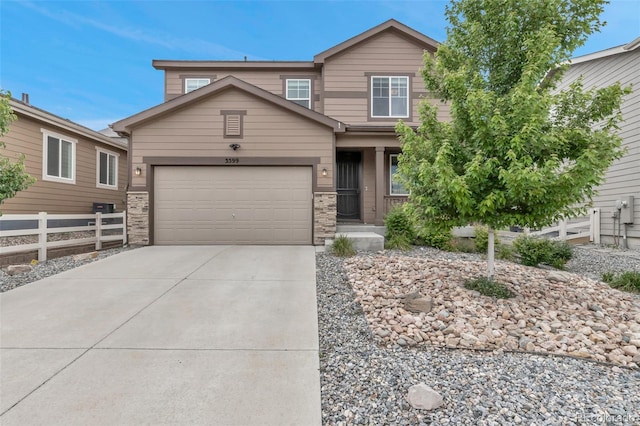 3599 Makley Cir, Castle Rock, CO 80104 - view of front of home featuring driveway, a garage, and stone siding