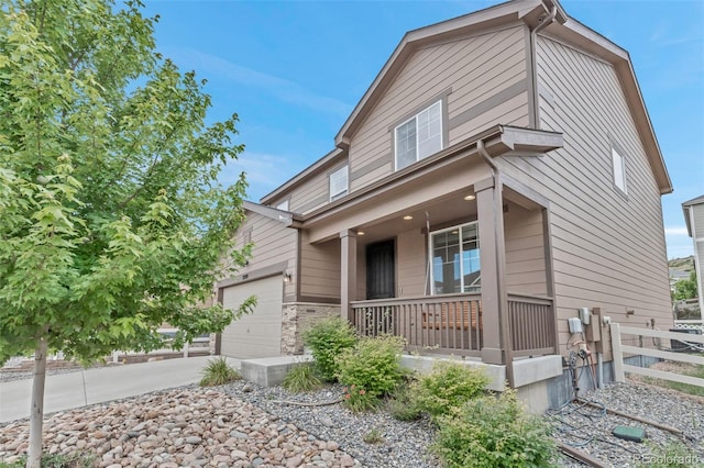 3599 Makley Cir, Castle Rock, CO 80104 - view of front of property with a porch, concrete driveway, and an attached garage