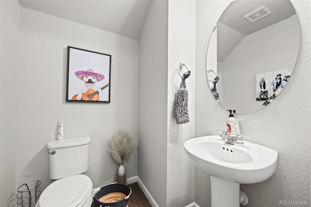 15503 W 65th Ave Unit C, Arvada, CO 80007 - half bath featuring wood finished floors and vaulted ceiling