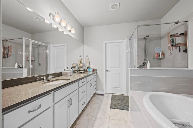 15503 W 65th Ave Unit C, Arvada, CO 80007 - bathroom with double vanity, a shower stall, and a garden tub
