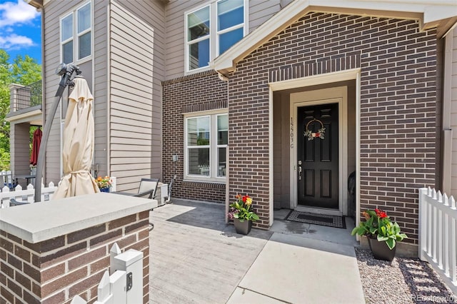 15503 W 65th Ave Unit C, Arvada, CO 80007 - doorway to property featuring brick siding