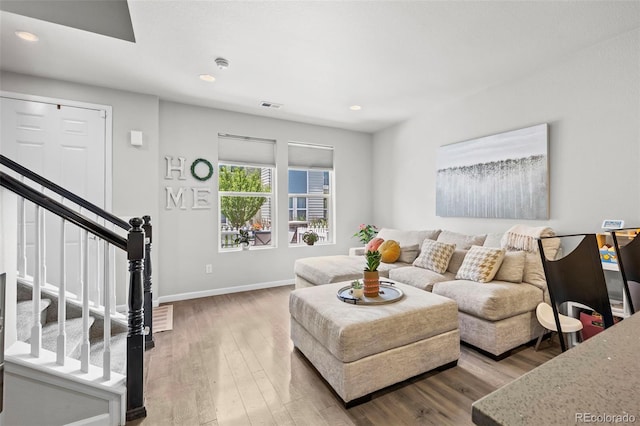 15503 W 65th Ave Unit C, Arvada, CO 80007 - living area featuring wood finished floors, recessed lighting, and stairs
