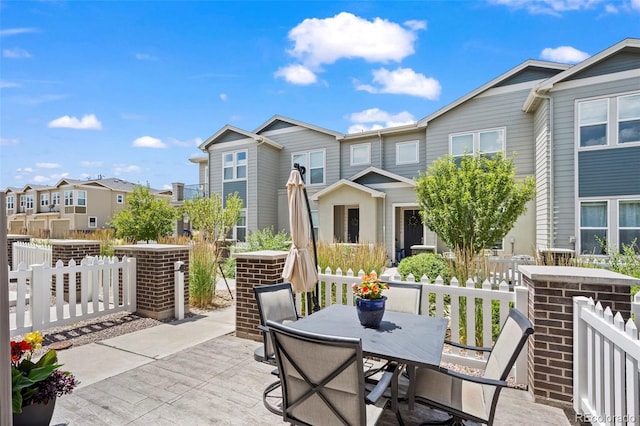 15503 W 65th Ave Unit C, Arvada, CO 80007 - view of patio with outdoor dining space and a residential view