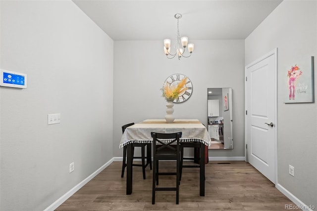 15503 W 65th Ave Unit C, Arvada, CO 80007 - dining area featuring a chandelier and wood finished floors
