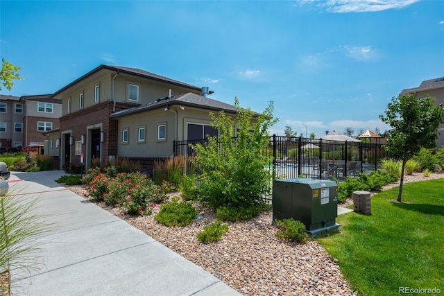 15503 W 65th Ave Unit C, Arvada, CO 80007 - view of side of home with brick siding and stucco siding